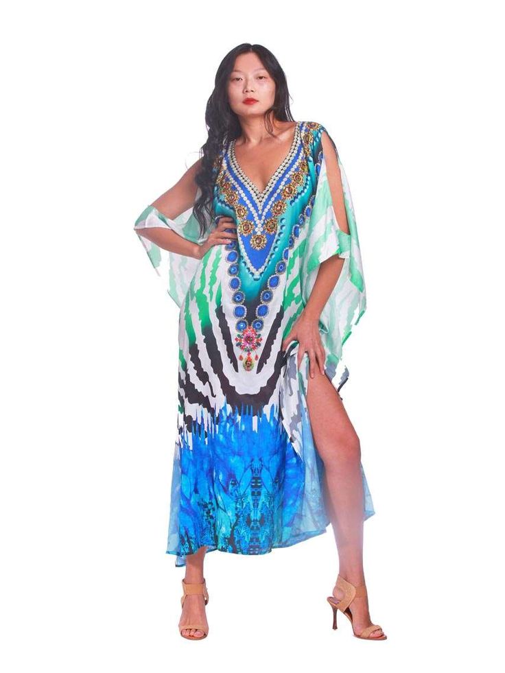 "Make a statement" "Elevate your wardrobe" "Bold print" "Luxurious" "Comfortable" "Elegant" "Sophisticated" "Perfect for any occasion" "Flair to your everyday look" "Multiple sizes" "Head-turning style" "Unbeatable comfort" Make a statement and elevate your wardrobe with the Turquoise Zebra Colt Shoulder! This kaftan boasts a bold print that exudes confidence and style. Crafted from luxurious poly satin, it offers unbeatable comfort that you won't find with any other piece in your wardrobe. The Elegant Green Kaftan For Vacation, Elegant Printed Beach Kaftan, Elegant Printed Multicolor Kaftan, Elegant Multicolor Printed Kaftan, Elegant Multicolor Kaftan For Vacation, Elegant Flowy Printed Kaftan, Elegant Fitted Multicolor Kaftan, Elegant Printed Kaftan For Spring, Spring Party Printed Kaftan