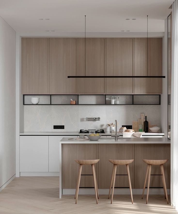 two stools sit in front of the kitchen counter