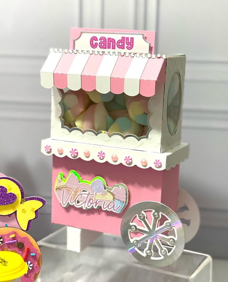 there is a candy stand with candies in it