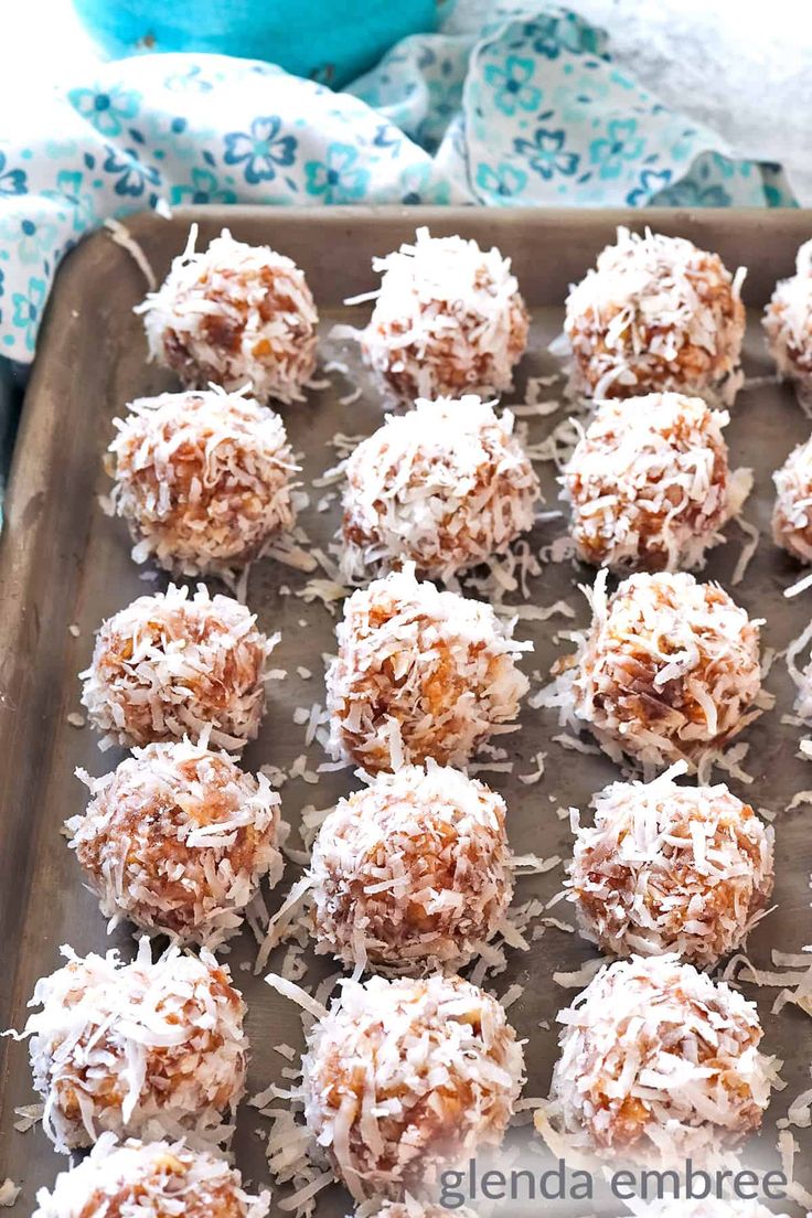 coconut balls on a baking sheet ready to be eaten