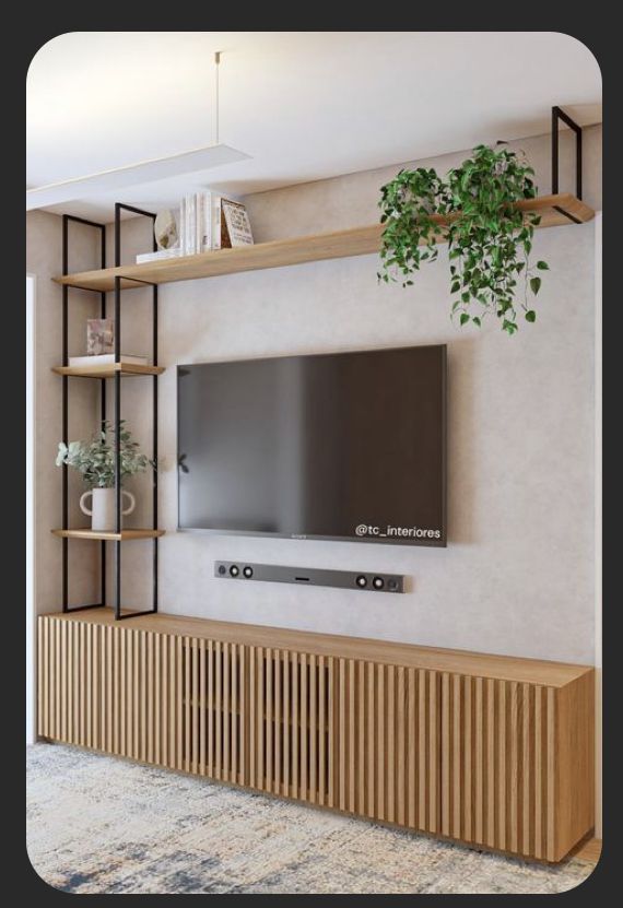 a flat screen tv mounted to the side of a wooden shelf in a living room