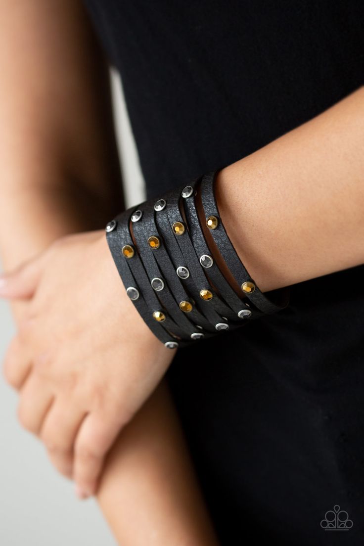 A thick black leather band has been spliced into eight strips across the wrist. Encased in sleek silver fittings, glittery hematite and aurum rhinestones are sprinkled across the center for a sassy finish. Features an adjustable snap closure.

Sold as one individual bracelet. Snap Bracelets, Black Sparkle, Bracelet Online, Paparazzi Accessories, Black Bracelets, Band Bracelet, Paparazzi Jewelry, Rhinestone Bracelet, Affordable Jewelry