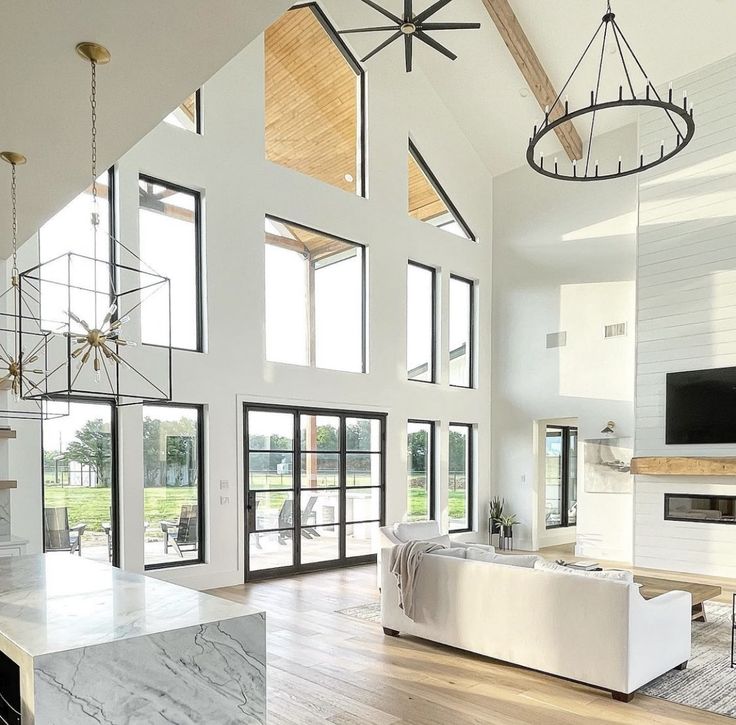 a large open living room with high ceilings