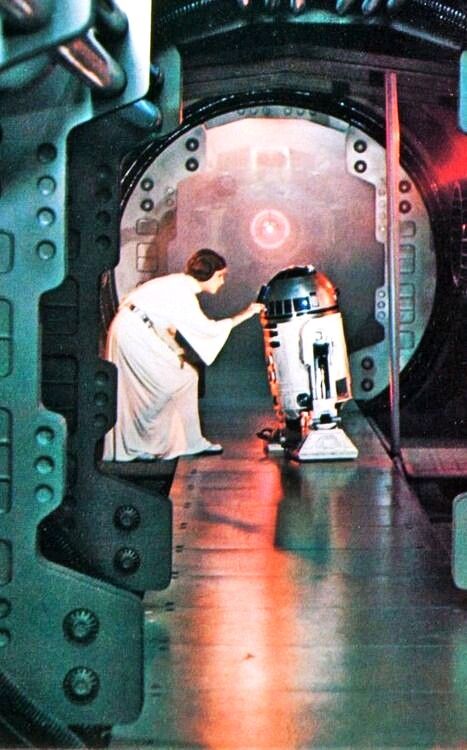 a star wars scene with r2d2 and c - 3po