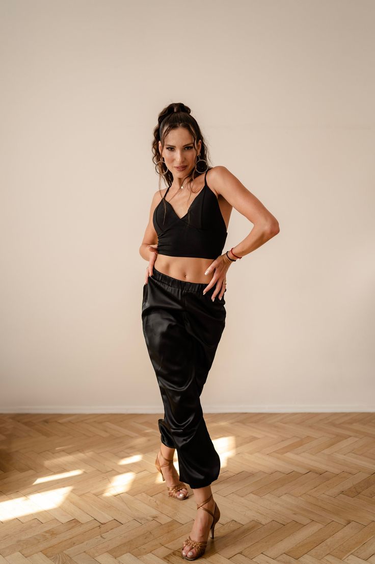 Our bestseller: stylish Latin trousers made from silky satin! This material gives them a special charm and shine. A perfect blend of comfort and elegance. The trousers feature eye-catching pleats along the entire length, adding a unique style and dynamism to them. Party Straight Satin Pants, Party Satin Straight Pants, Stretch Satin Bottoms For Night Out, Elegant Stretch Harem Pants With Elastic Waistband, Elegant Harem Pants With Elastic Waistband, Satin Pants For Evening, Silk Wide-leg Pants For Party, Evening Satin Straight Pants, Party Stretch Satin Bottoms