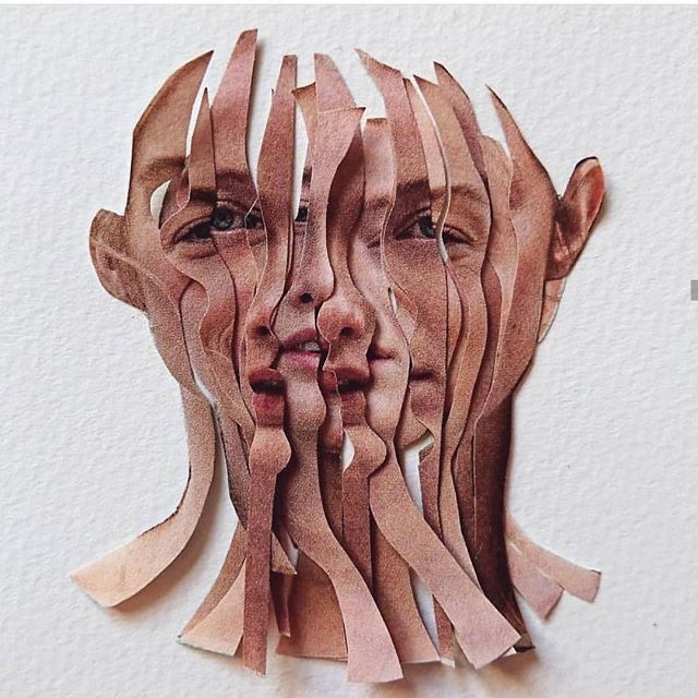 a woman's face is made out of strips of wood and paper with her eyes closed