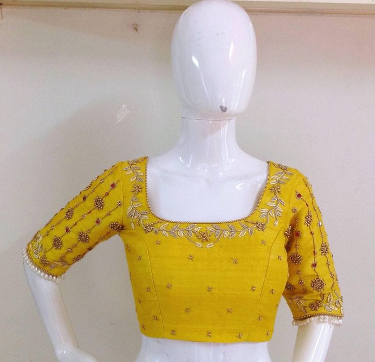 Pure raw silk blouse with maggam work on neck sleeves and back neck. Custom fitted. -Measurements sheet will be sent to you once you order( Standard sizing also available) -Custom colors available -Work on front back and sleeves. Designer Yellow Blouse With Resham Embroidery, Yellow Resham Embroidered Top For Wedding, Festive Yellow Blouse With Resham Embroidery, Festive Yellow Resham Embroidery Blouse, Embroidered Yellow Chanderi Blouse, Designer Embroidered Yellow Blouse Piece, Yellow Embroidered Chanderi Blouse, Designer Embroidered Yellow Blouse, Designer Yellow Embroidered Blouse