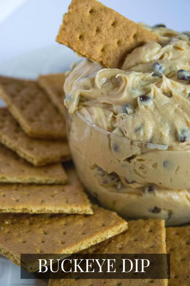 crackers and dip in a bowl with cookies on the side