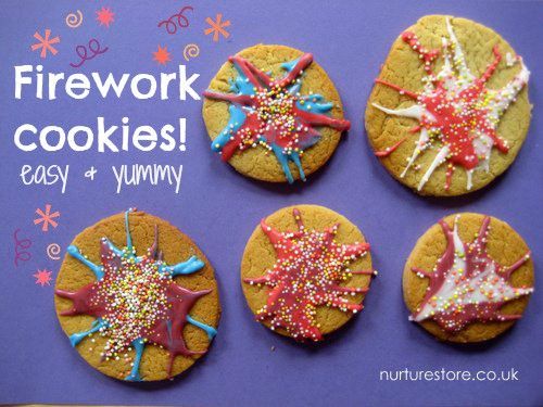 four decorated cookies sitting on top of a purple board with the words firework cookies easy and yummy