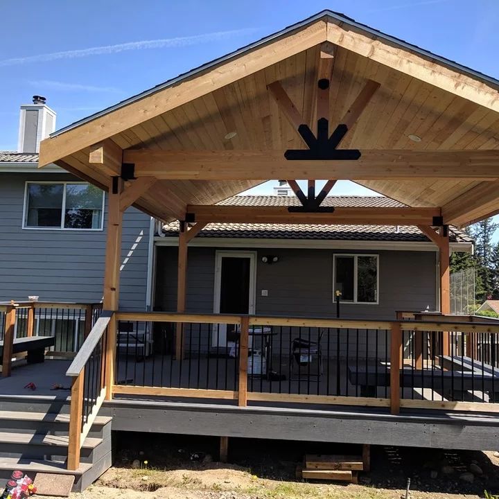 a covered patio with stairs leading up to it