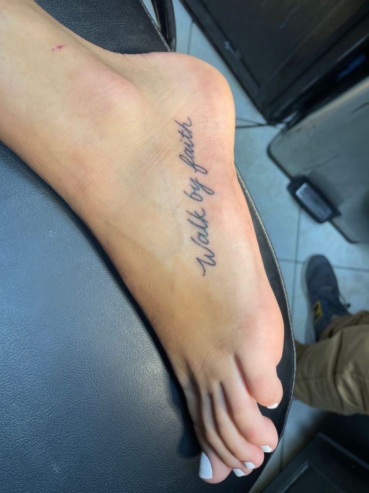 a person with a tattoo on their foot that says, i love you to the moon and back