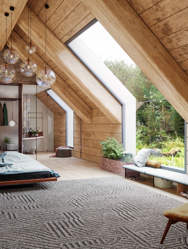 an attic bedroom with large windows and wooden walls, carpeted flooring, and a bed