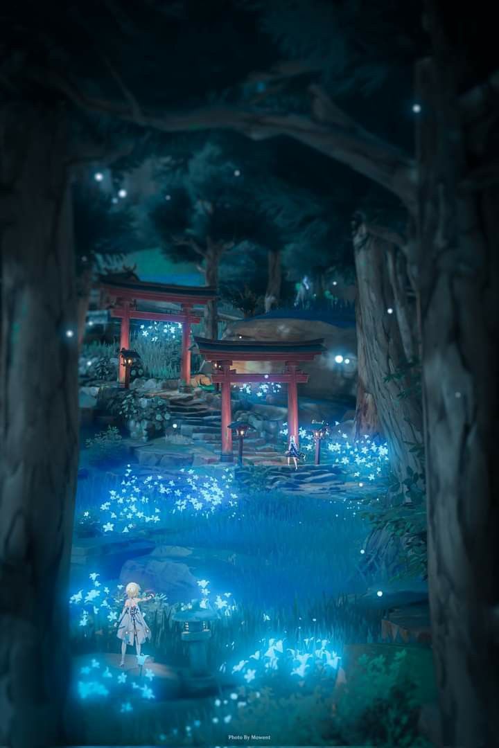 an image of a person standing in the middle of a forest at night with blue lights