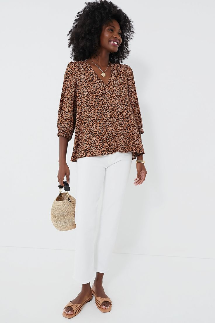 Leopard is back and we are obsessed with the Hollis Top! Featuring a playful print, V-neckline, and slightly puffed sleeves, this polished number is perfect for an elevated daytime look or for cocktail hour. We are pairing it with denim and sandals for an effortlessly chic throw-on-and-go look. V-neckline Three-quarter length sleeves Elastic cuffs Longer back Relaxed fit Material: 100% Polyester Care: Hand wash cold, hang to dry. Do not bleach, do not iron. V-neck Printed Blouse For Workwear, Chic Printed Blouse With Balloon Sleeves, Chic Puff Sleeve Top With Floral Print, Chic Puff Sleeve Top For Casual Gatherings, Chic V-neck Puff Sleeve Top For Summer, Spring V-neck Puff Sleeve Top For Brunch, Spring Brunch V-neck Puff Sleeve Top, Chic V-neck Puff Sleeve Top For Day Out, Casual Printed Puff Sleeve Top For Summer