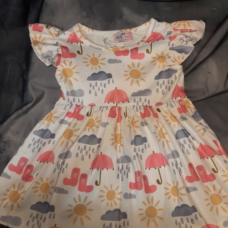 This Adorable Short Sleeve Dress Is A 6-12mo. Buttery Soft "Milk Silk" Fabric (95% Polyester/5%Spandex) With Rain Clouds, Shining Sun And Pink Umbrellas With Rain Boots Pattern. Casual Flutter Sleeve Twirl Dress For Playtime, Spring Cotton Stretch Twirl Dress, Cute Spring Twirl Dress With Stretch, Cute Spring Stretch Twirl Dress, Cute Stretch Twirl Dress For Spring, Fitted Flutter Sleeve Twirl Dress For Playdate, White Short Sleeve Twirl Dress For Playdate, White Short Sleeve Twirl Dress, Spring Twirl Dress With Short Sleeves For Play