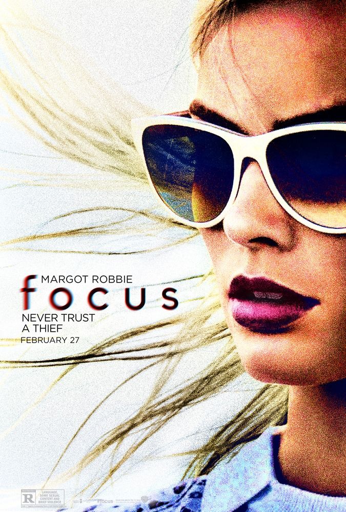 a woman wearing sunglasses with her hair blowing in the wind and text focus on it