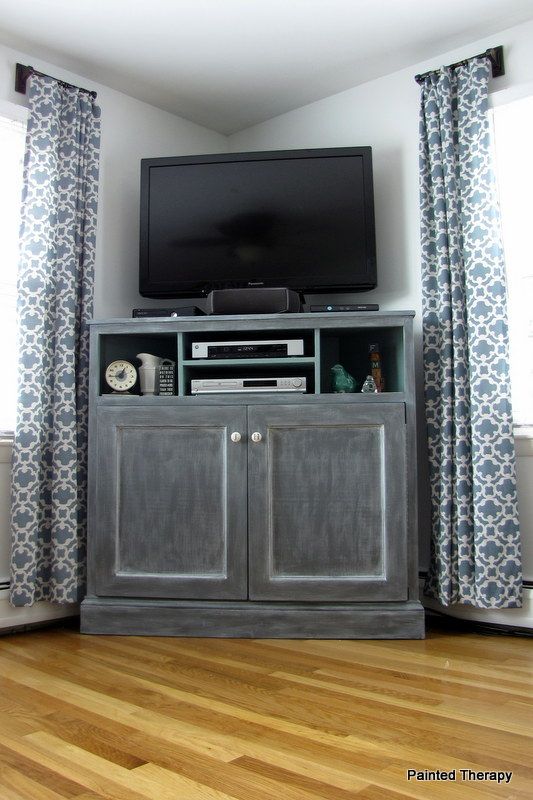 Build your own "Get Out of the Way of the TV" console. With cabinets for toys and books! Move TV to where leather chair is. Tall Corner Tv Stand, Media Console Diy, Build A Tv Stand, Corner Tv Cabinet, Corner Entertainment Center, Corner Tv Console, Tv Stand Plans, High Tv Stand, Tall Tv Stands