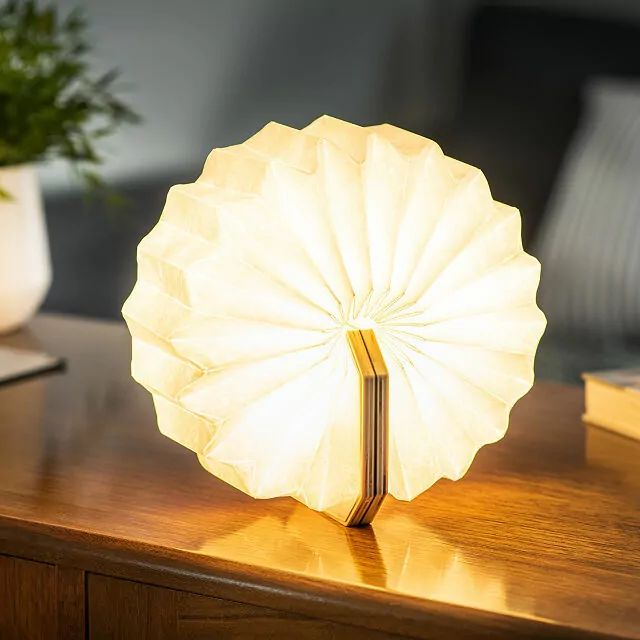 a lamp sitting on top of a wooden table