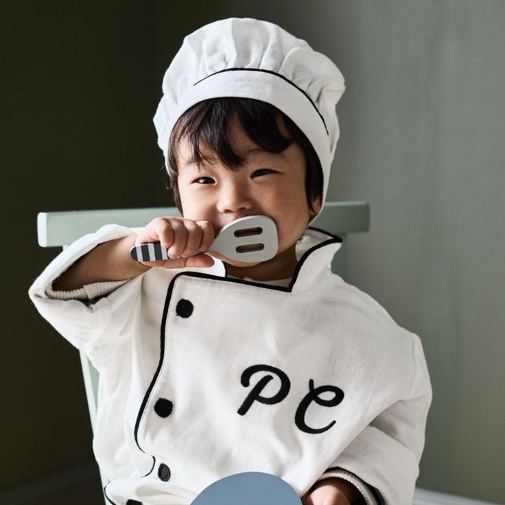 Calling all mini cooks! Our junior chef hat and coat will inspire you to jump into the play kitchen and create your next pretend culinary masterpiece. Great for imaginative play and dress-up time, the kid-sized chef hat and coat have embroidered details, high-quality cotton fabric and a soft hand-feel. Accessorize with our Junior Chef Apron to complete this foodie-friendly look.   • Kids chef coat and hat for dress-up play  • Suitable for kids ages 3-6 years old.  • Sophisticated embroidered loo Best Kids Christmas Gifts, Kids Christmas Gift Ideas, Junior Chef, Kid Chef, Hungry Children, Gift Ideas For Kids, Chef Coat, Feeding America, Chef Hat