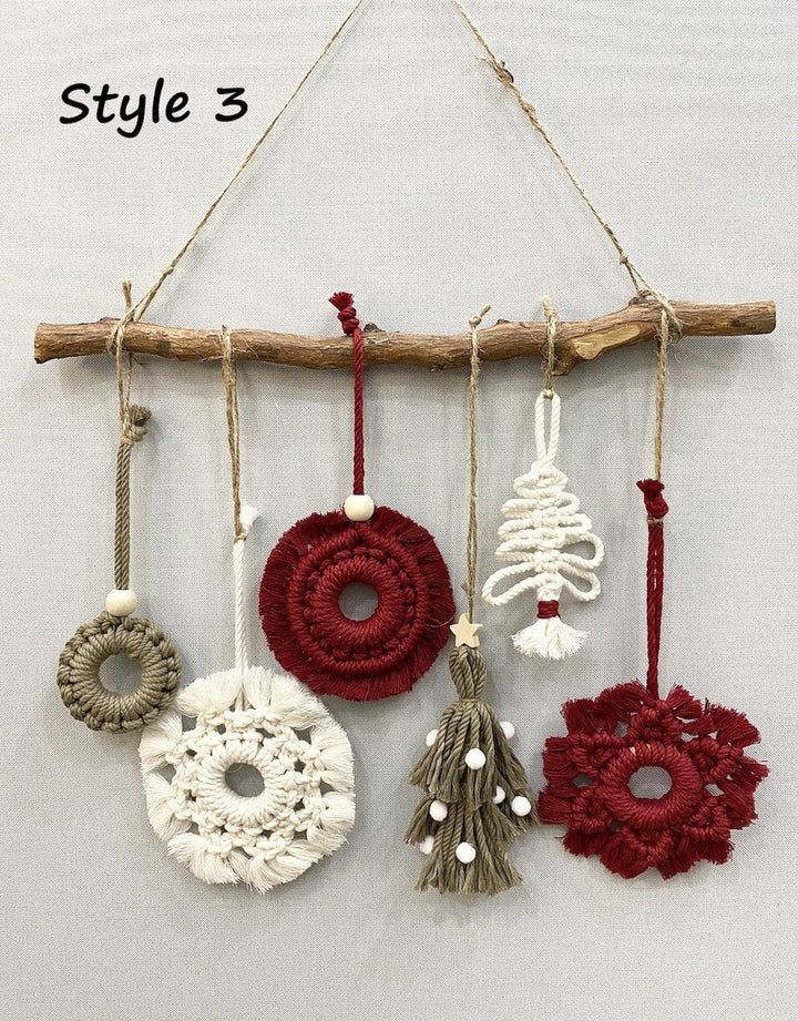 four ornaments hanging from a wooden branch on a white wall with the words style 3 written below them