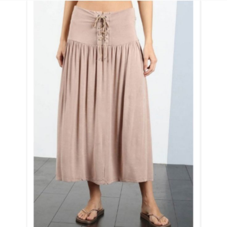 Expertly Crafted In Soft Jersey And Finished With A Washed Texture, Our Laced Maxi Skirt Is The Epitome Of Comfort And Style. The Laced Front Adds A Touch Of Elegance To This Everyday Essential, Making It A Versatile Choice For Any Occasion. Perfect For A Feminine And Effortless Look. Manufactured By Pol Clothing So You Know You Are Getting A Quality Product. 60 Cotton, 35 Polyester, 5 Spandex Cotton Midi Bottoms For Vacation, Casual Midi-length Bottoms For Vacation, Solid Rayon Skirt For Summer, Bohemian Solid Color Skirt For Day Out, Casual Midi Length Bottoms For Vacation, Solid Color Bohemian Skirt For Day Out, Bohemian Midi Bottoms For Beach, Bohemian Midi Length Bottoms For Beach, Bohemian Midi Length Beach Bottoms