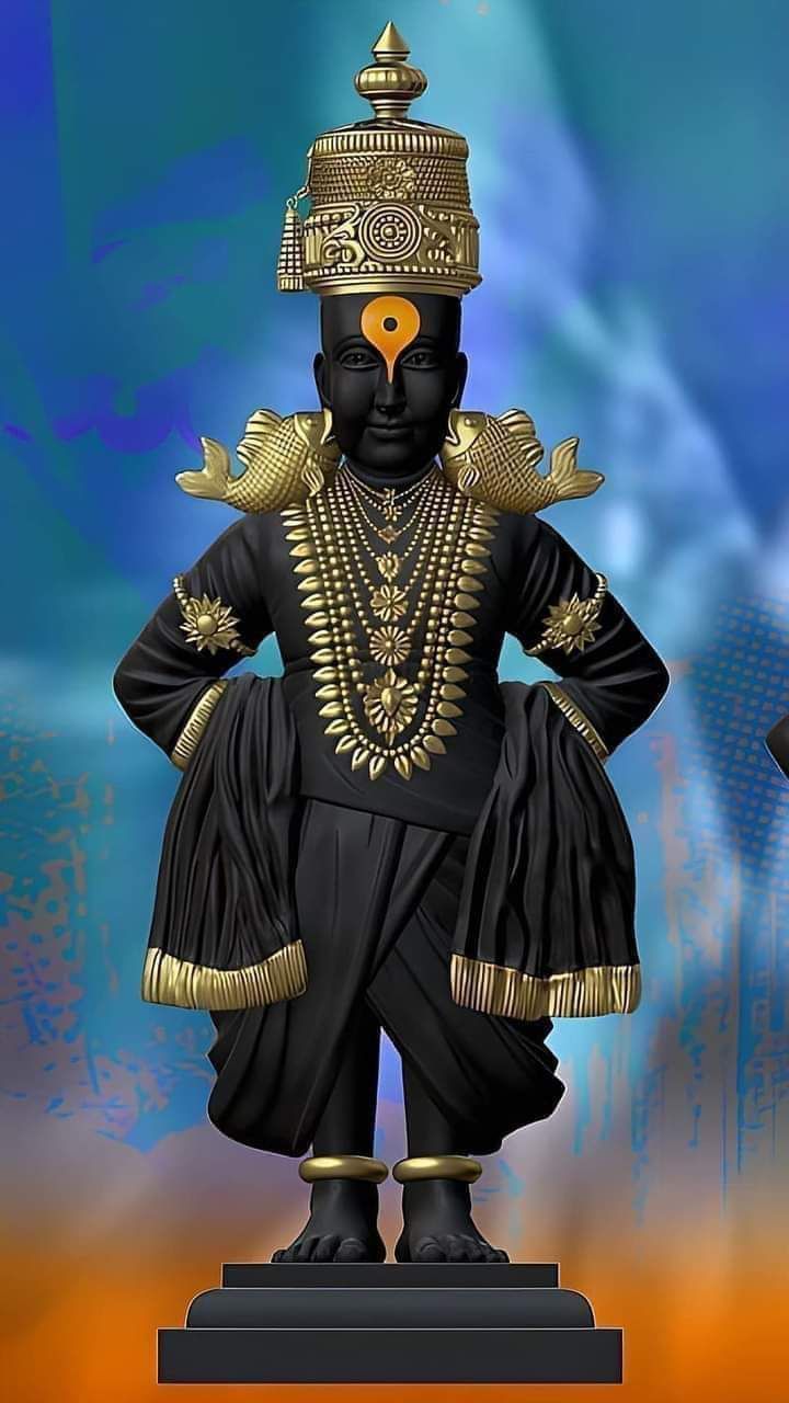 the statue is black with gold accents on it's face and body, standing in front of a blue background