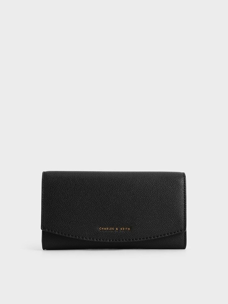 If you are looking for a wallet that is compact in size but can still fit your cash, cards and curios, then this long front flap wallet is a must-have. Featuring a snap-button closure for easy access, this wallet in a classic black hue is a functional piece for the new season. Carry it on its own or slip it into your daily bag. Match it with a button-down shirt and a pencil skirt for a chic work look. Black Curves, Daily Bag, Charles Keith, A Pencil, Work Looks, Long Wallet, Kids Gifts, New Season, Snap Button