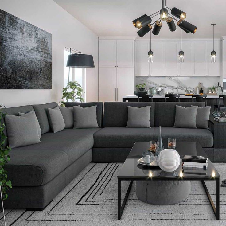 a living room filled with lots of furniture and decor on top of a white floor