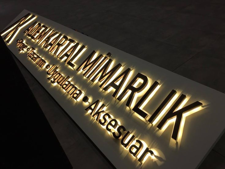 the illuminated sign is on display for people to see