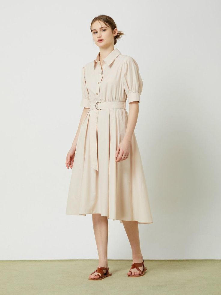 This belted flared long dress exudes a feminine and elegant style with its flared silhouette, shirring at the waist, and voluminous sleeves.- Long length that makes your outfit stylish- A-line silhouette to add appeal to the item- D-ring belt detail for added interest* The color of the actual product may vary due to differences in monitor color settings and resolution. Elegant Beige Midi Length Belted Dress, Elegant Beige Midi Dress With Pleated Waist, Elegant Beige Belted Dress, Elegant Pleated Belted Dress For Spring, Elegant Spring Pleated Belted Dress, Formal Beige Midi Dress With Pleated Waist, Spring Knee-length Midi Dress With Belted Cuffs, Workwear A-line Maxi Dress With Belt, Workwear Belted A-line Maxi Dress