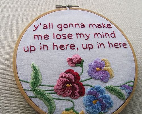 a cross stitch quote with flowers on it