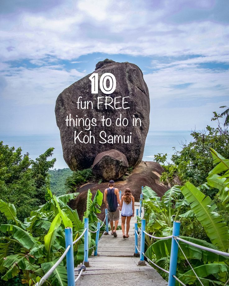 two people walking down a wooden walkway with a large rock in the background that says, 10 fun free things to do in koh samui