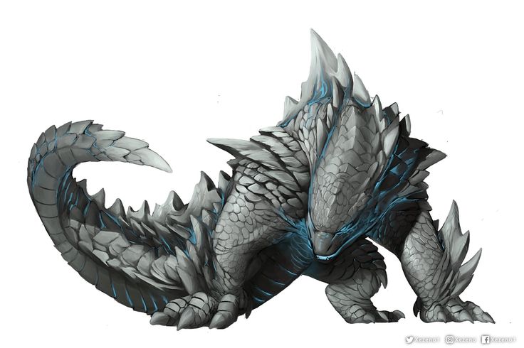 a large gray and blue dragon sitting on top of a white surface