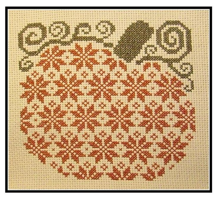 a cross stitch pattern with an apple on it