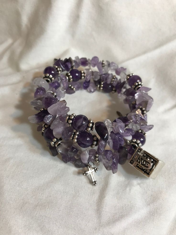 "The Amethyst Crystal Stone has healing properties are connected to your headspace, and work to sooth your mind of any worries, stress, or tension. This bracelet unwrapped approximate length is 26\" inches. It is a replacement for the stretchy bracelets I previously made as you get more bracelet now for the money, and don't have to worry about breakage. The Memory Wire Wrapped Prayer Box Bracelet consist of Amethyst Chip Beads that are separated at points with Sterling Silver Spacer Beads, 8mm Round Amethyst Stone Beads, the round beads are capped with Sterling Silver Daisy Bead Caps, the main charm is a drop antique silver-finished pewter (zinc-based alloy) 15x10mm cube prayer box with swirl design and magnetic safety latch with lobster claw clasp. The prayer box actually opens to store m Adjustable Wrap Bracelet With 108 Beads For Healing, Adjustable Wrap Bracelet With 108 Beads For Meditation, Spiritual Lavender Beaded Bracelets As Gift, Adjustable Rosary Bracelet For Healing With 108 Beads, Spiritual Style Wrap Bracelet With 8mm Beads As Gift, Spiritual Healing Wrap Bracelet With Round Beads, Adjustable Spiritual Wrap Bracelet With Natural Stones, Adjustable Spiritual Stretch Bracelet Hand Wrapped, Spiritual Wrap Bracelet With Round Beads For Meditation