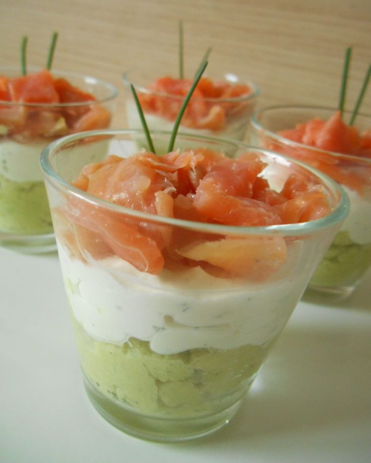 small cups filled with food sitting on top of a table