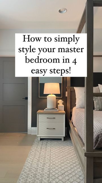 a white bed sitting next to a night stand on top of a hard wood floor