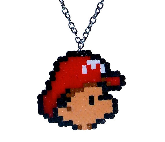 a necklace with an image of mario on it