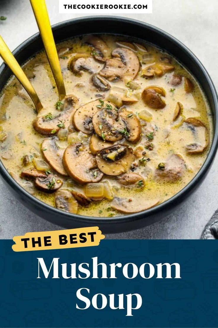 the best mushroom soup in a black bowl with two yellow spoons and a blue background