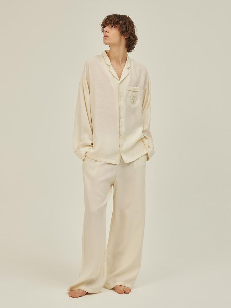 The pajama set is consist of a long sleeves pajama shirt and a pants. The pajama features signature logo embroidery and piping point. Made of durable cotton fabric, the pajama set is easy to care and makes lightweight and comfy fit. The relaxed fit, hip-length shirt, and elastic band waist make the pajama fit any body shape.- Button closure- Collar neck- Elastic band waist- Side pockets Classic Long Sleeve Sleep Sets, Classic Relaxed Fit Loungewear Sets, Classic Relaxed Fit Long Sleeve Sets, Classic Sets With Relaxed Fit And Long Sleeve, Classic Long Sleeve Relaxed Fit Sleepwear, Pajama Packaging, Pajama Couple, Pjs Men, Mens Silk Pajamas