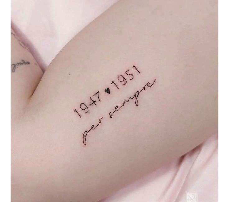 a woman with a tattoo on her arm that says,'1917 - 2011 per sempre