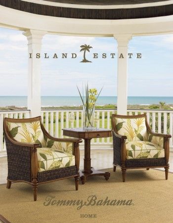 two chairs sitting on top of a rug in front of a porch with the words island estate