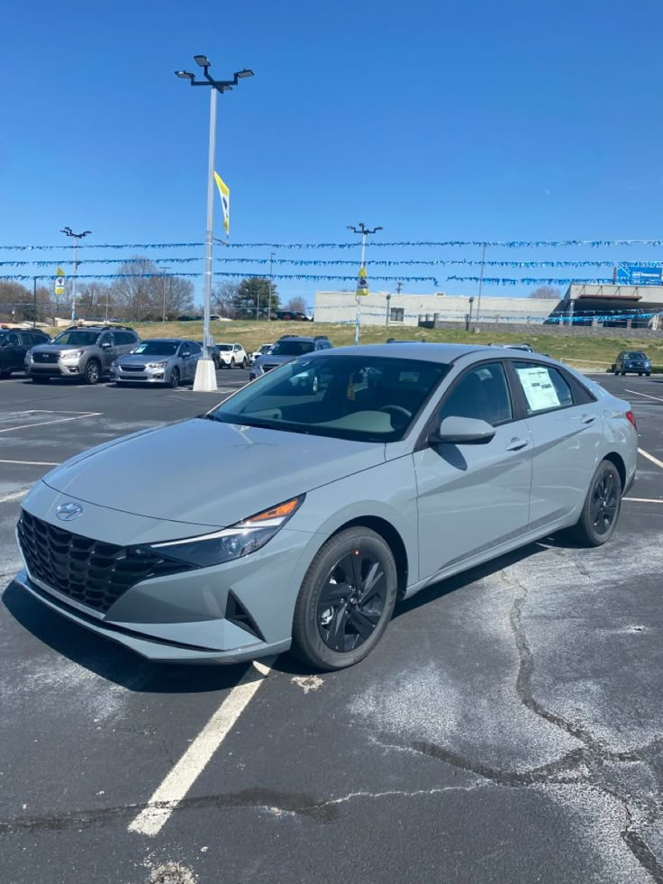 a silver car parked in a parking lot