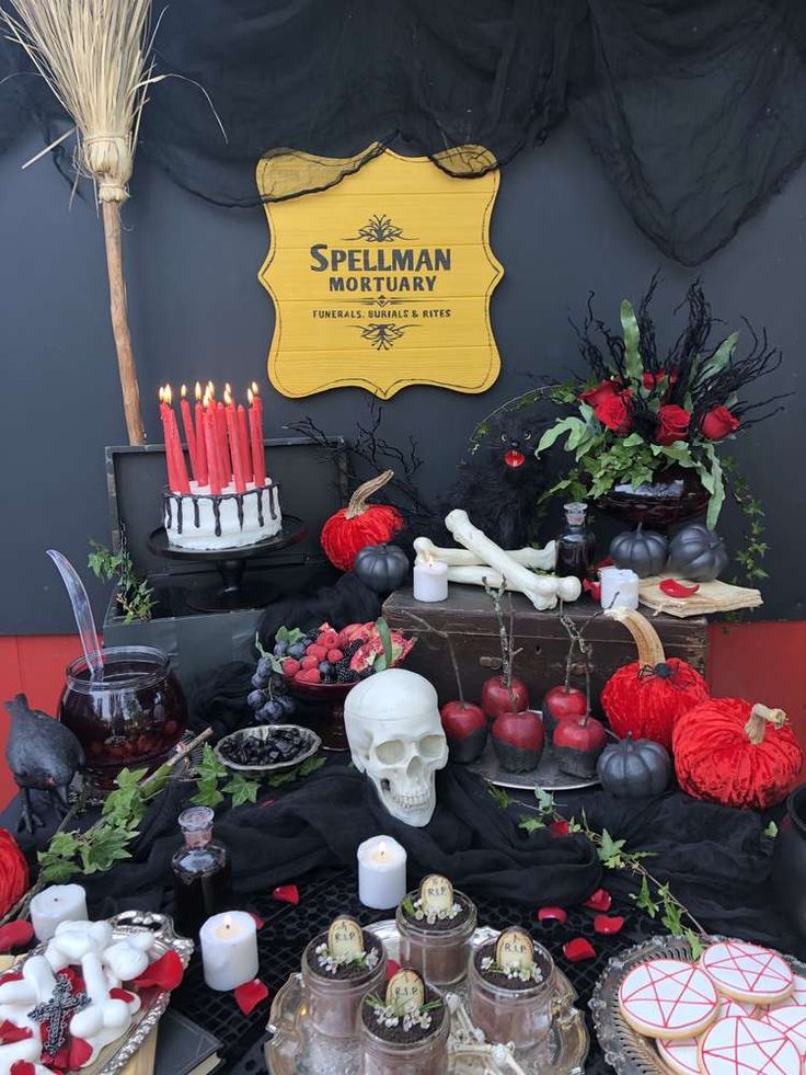 a table topped with lots of desserts and candles