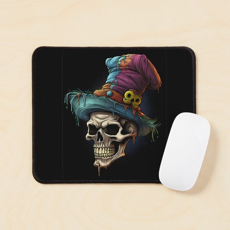 a mouse pad with a skull wearing a witches hat on it and a computer mouse