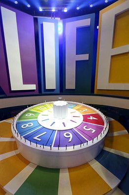 a colorful clock sitting in the middle of a room