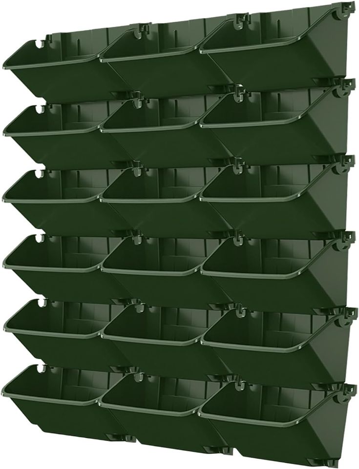 green bins are stacked on top of each other in the shape of pyramids