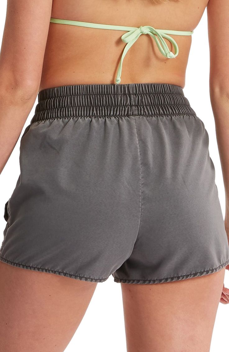 An easy-fitting shirred drawstring waist tops these swim shorts offering sporty style that's comfy on land and in the water. 2" inseam; 26" leg opening; 13" front rise; 17" back rise (size Medium) 100% polyester Machine wash, tumble dry Imported High-waisted Swim Trunks With Elastic Waistband For Poolside, Casual Poolside Shorts With Elastic Waistband, Sporty Relaxed Fit Pajama Shorts For Beach Season, Sports Pajama Shorts With Elastic Waistband, Sporty Stretch Pajama Shorts For Vacation, Sports Pajama Shorts With Elastic Waistband And Relaxed Fit, Athleisure Pajama Shorts With Elastic Waistband For Vacation, Casual High-waisted Workout Swim Trunks, Poolside Shorts With Elastic Waistband