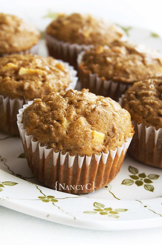 some muffins are sitting on a white plate