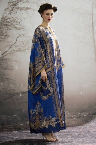 Blue silk long kaftan with all over regal floral prints and narrow yellow panel work. - Aza Fashions Royal Blue Long Kaftan, Elegant Blue Kaftan With Dabka Details, Ceremonial Eid Kaftan In Maxi Length, Festive Floor-length Blue Kaftan, Royal Blue Kaftan For Eid, Blue Long Abaya For Festive Occasions, Festive Blue Floor-length Kaftan, Festive Blue Long Abaya, Festive Long Blue Abaya